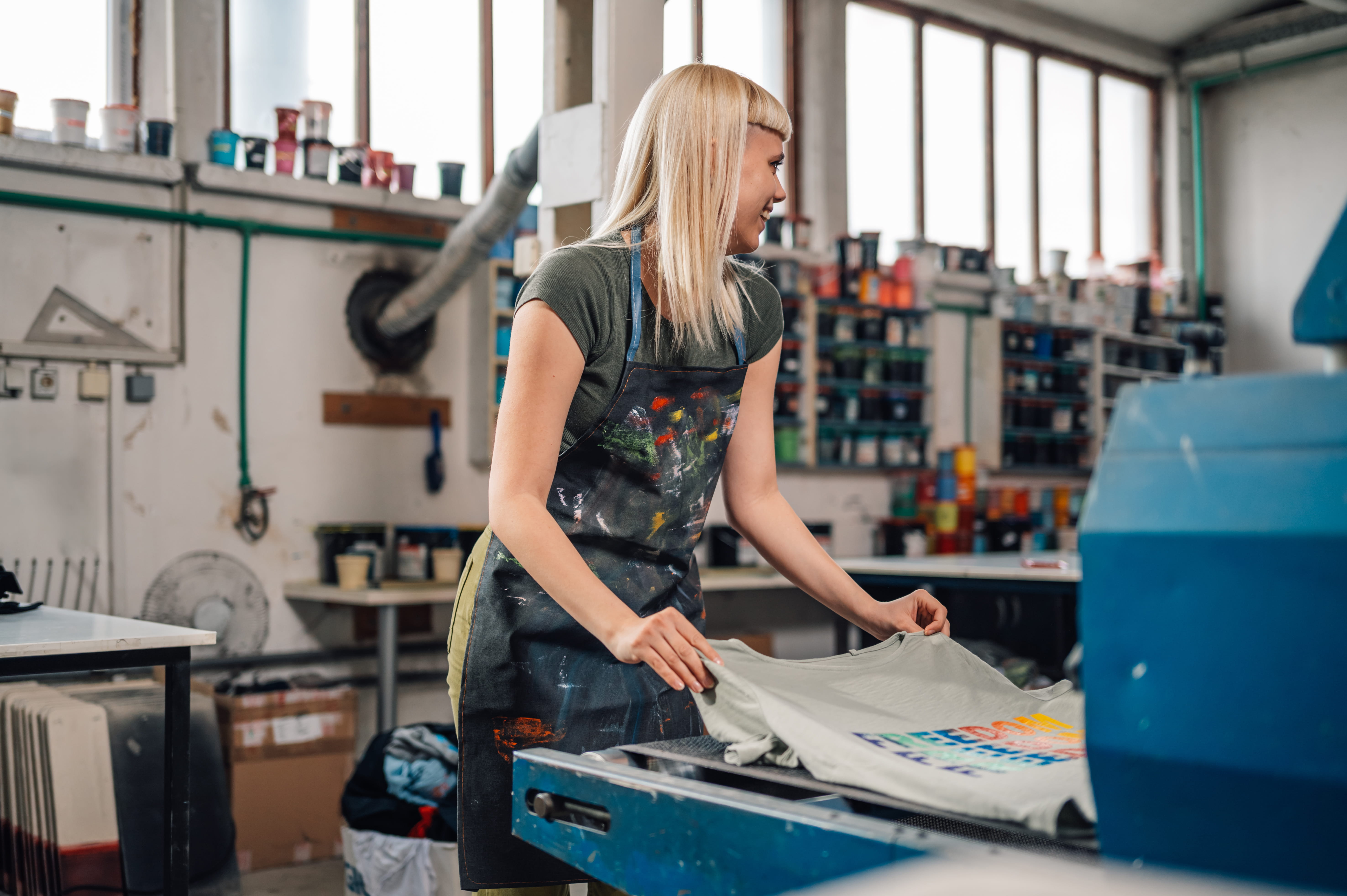 woman preparing a t shirt for printing utc